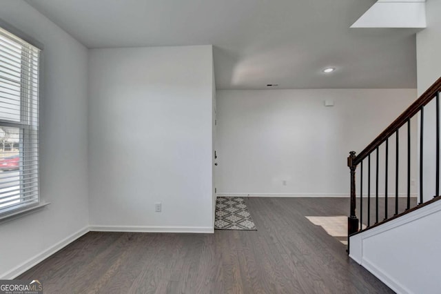 5530 Bower Pl, Cumming, GA 30028 - interior space featuring baseboards, stairs, wood finished floors, and a healthy amount of sunlight