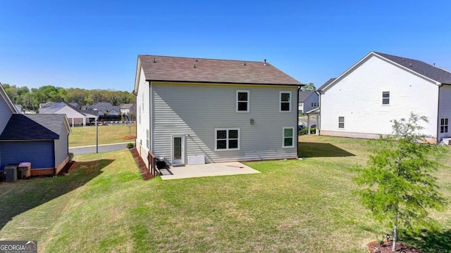 5530 Bower Pl, Cumming, GA 30028 - back of property with a patio and a lawn