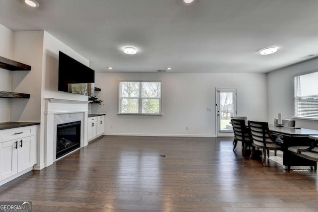 5530 Bower Pl, Cumming, GA 30028 - living room featuring recessed lighting, dark wood finished floors, baseboards, and a premium fireplace