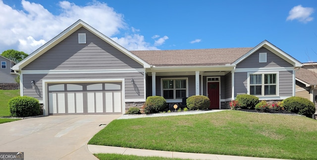 craftsman-style home with driveway, a garage, stone siding, and a front lawn
