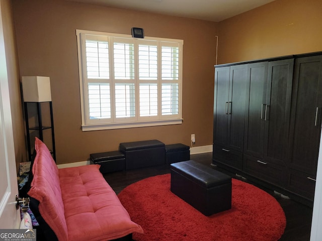 interior space with wood finished floors and baseboards