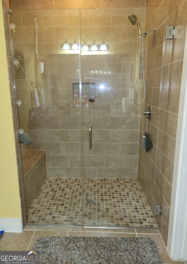 full bath featuring a shower stall