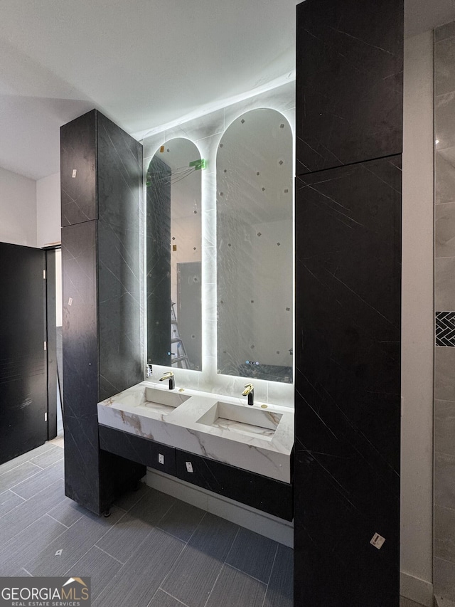 1068 Buckner Rd SE, Mableton, GA 30126 - full bath featuring a sink, double vanity, and tile patterned flooring