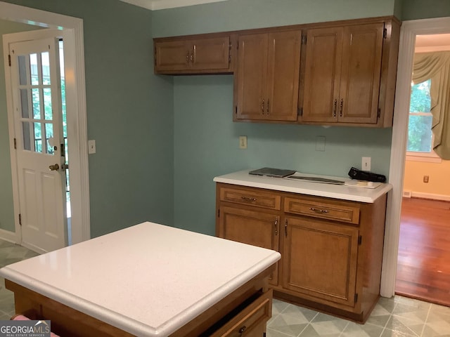10 Horseshoe Bend Rd SW, Rome, GA 30165 - kitchen with brown cabinetry, baseboards, and light countertops