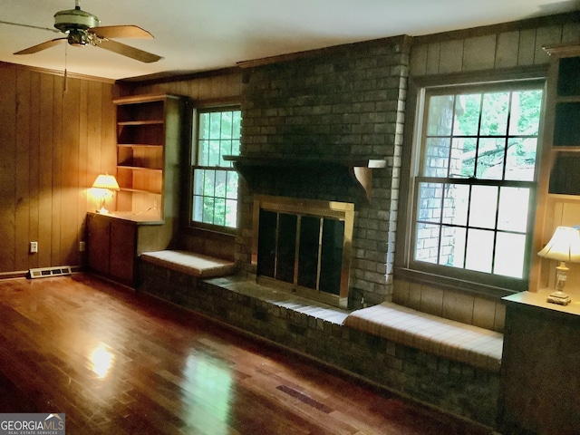 10 Horseshoe Bend Rd SW, Rome, GA 30165 - unfurnished room featuring plenty of natural light, visible vents, wood walls, and a ceiling fan