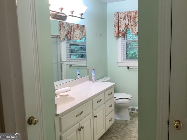 10 Horseshoe Bend Rd SW, Rome, GA 30165 - bathroom featuring vanity, toilet, a notable chandelier, and visible vents