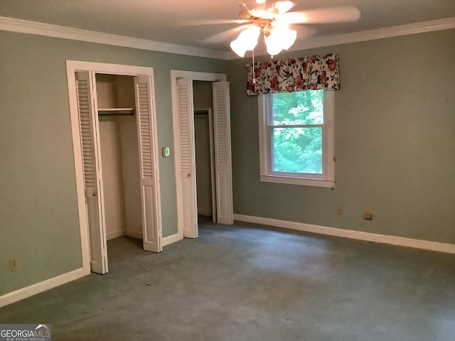 10 Horseshoe Bend Rd SW, Rome, GA 30165 - unfurnished bedroom featuring two closets, ornamental molding, carpet flooring, and baseboards
