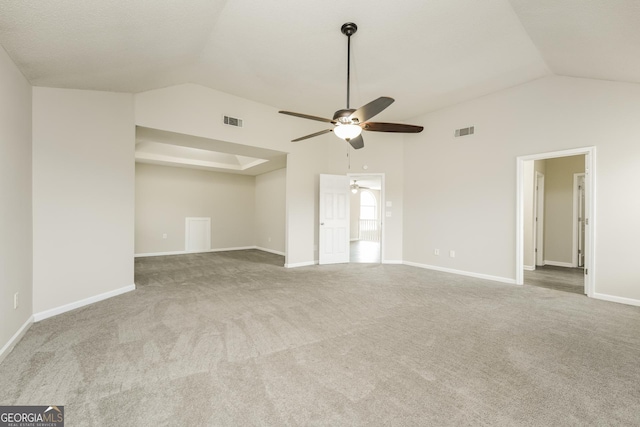 unfurnished room featuring ceiling fan, lofted ceiling, and visible vents
