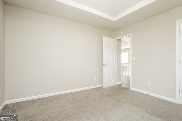 unfurnished bedroom with carpet floors and baseboards