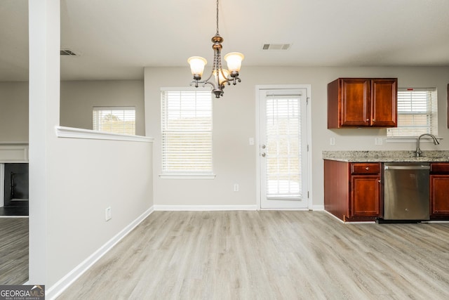kitchen featuring visible vents, light wood-type flooring, a chandelier, light stone countertops, and stainless steel dishwasher
