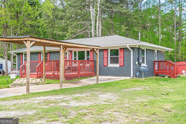 single story home featuring roof with shingles, brick siding, and a front lawn