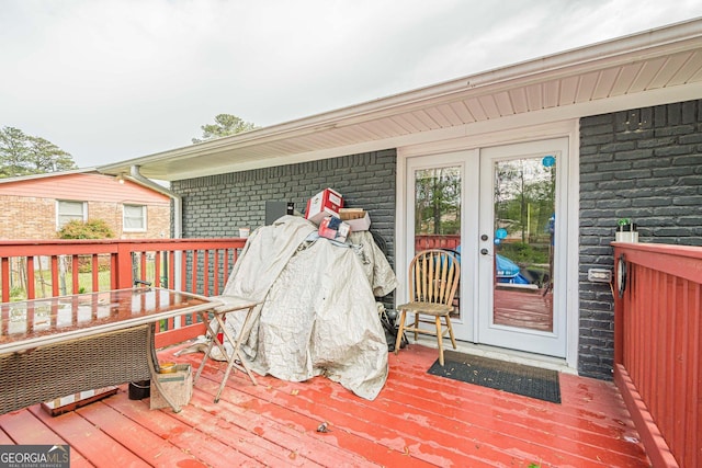 wooden deck featuring french doors