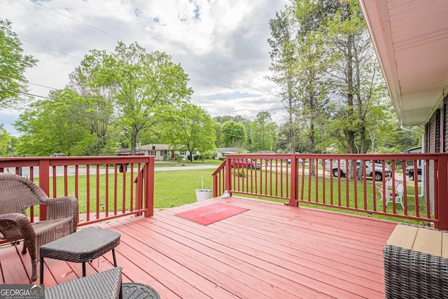 wooden deck with a yard