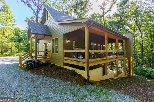 318 Lees Ride Unit 8, Mccaysville, GA 30555 - view of property exterior featuring a chimney and a shingled roof