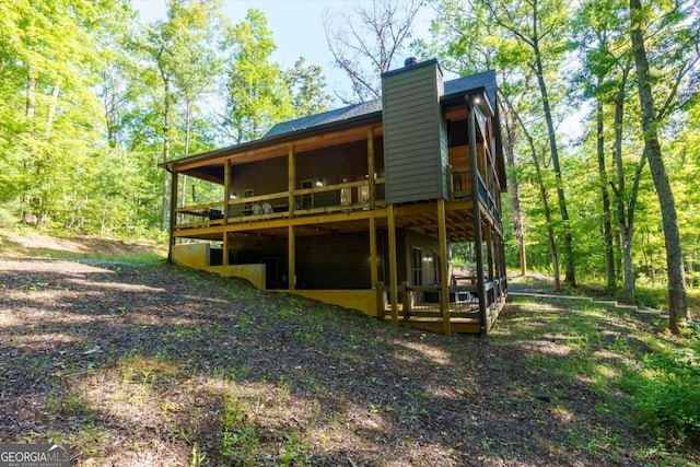 318 Lees Ride Unit 8, Mccaysville, GA 30555 - rear view of property featuring a chimney and a deck