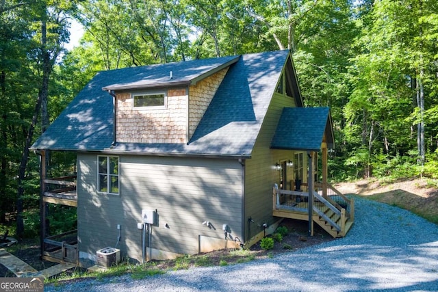 318 Lees Ride Unit 8, Mccaysville, GA 30555 - view of side of property with central air condition unit and roof with shingles