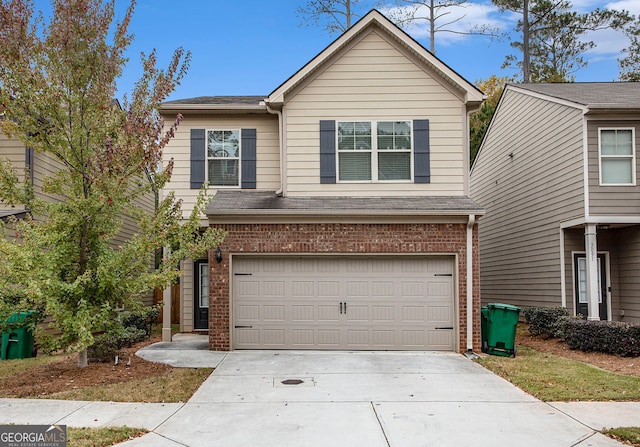 view of front of house with a garage, concrete driveway, and brick siding