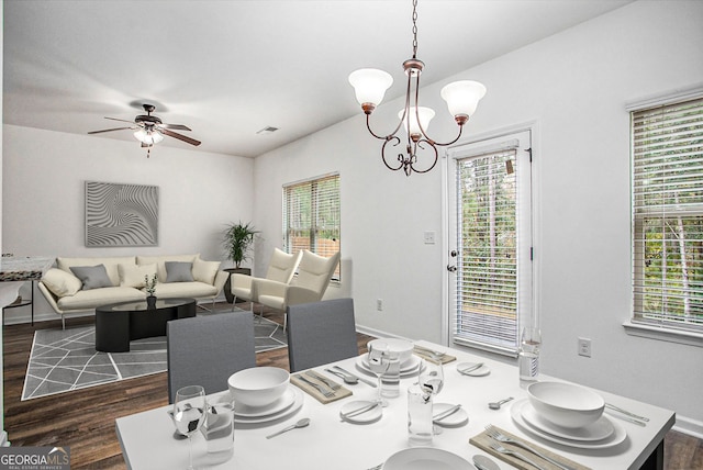 dining room with visible vents, plenty of natural light, and dark wood-style floors