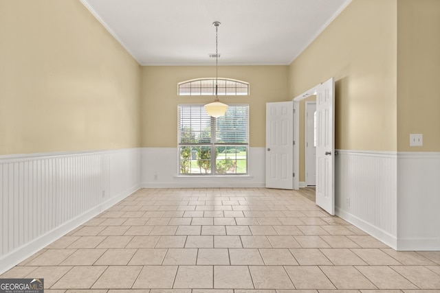 911 Larkspur Ln, Saint Marys, GA 31558 - unfurnished room featuring crown molding, light tile patterned floors, and a wainscoted wall