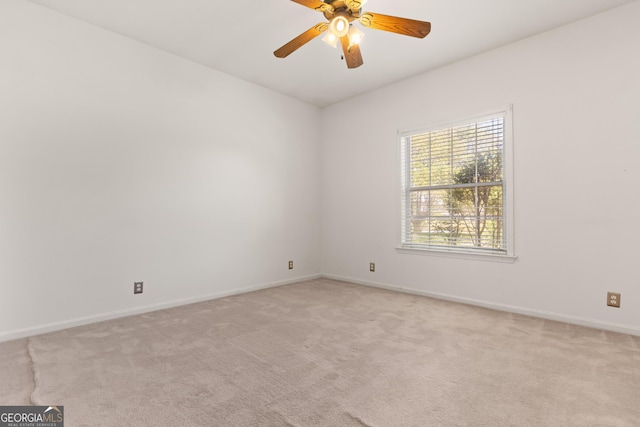 911 Larkspur Ln, Saint Marys, GA 31558 - unfurnished room featuring light colored carpet, baseboards, and a ceiling fan