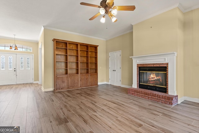 911 Larkspur Ln, Saint Marys, GA 31558 - unfurnished living room with crown molding, wood finished floors, ceiling fan, and baseboards