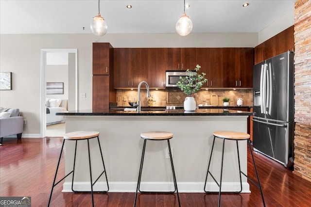 711 Cosmopolitan Dr NE Unit 347, Atlanta, GA 30324 - kitchen featuring stainless steel appliances, a kitchen bar, a sink, and backsplash