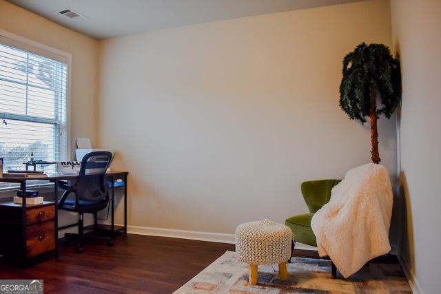 1058 Mays Hl, Atlanta, GA 30336 - office with wood finished floors, baseboards, and visible vents