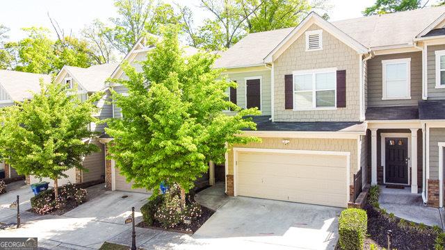1058 Mays Hl, Atlanta, GA 30336 - townhome / multi-family property with an attached garage and driveway