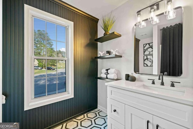 bathroom featuring baseboards and vanity
