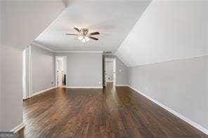 bonus room with wood finished floors, baseboards, and a ceiling fan
