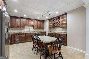 dining area with recessed lighting and baseboards