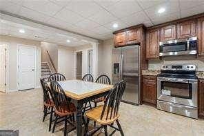 kitchen featuring light countertops, appliances with stainless steel finishes, and recessed lighting