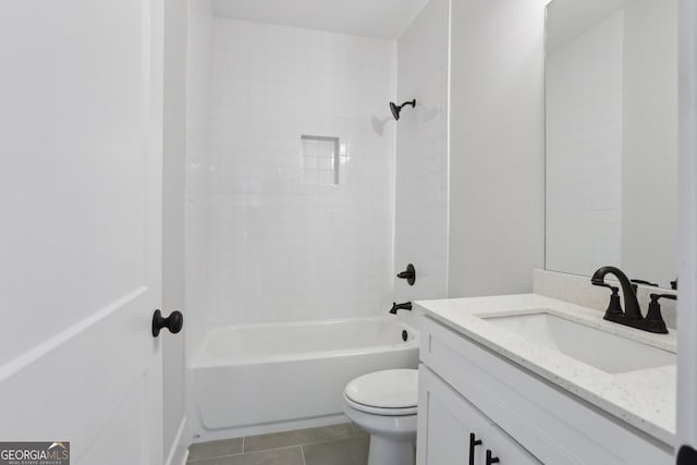 full bath with toilet, tile patterned floors, vanity, and shower / tub combination