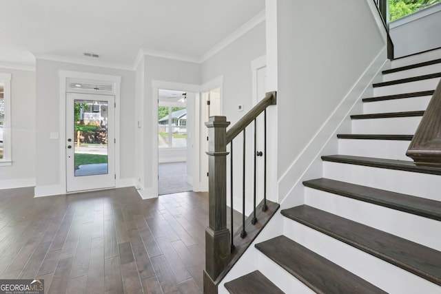 foyer with ceiling fan, ornamental molding, stairway, baseboards, and dark wood-style floors