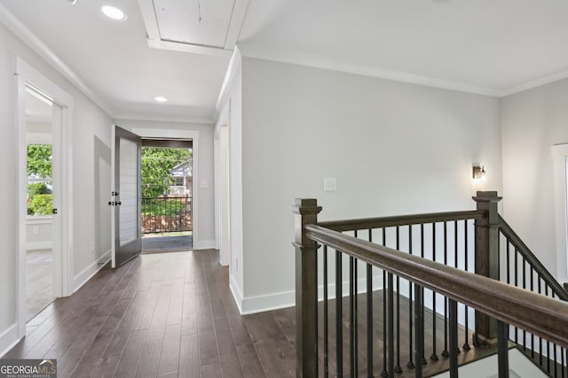interior space featuring dark wood-type flooring, recessed lighting, attic access, an upstairs landing, and baseboards