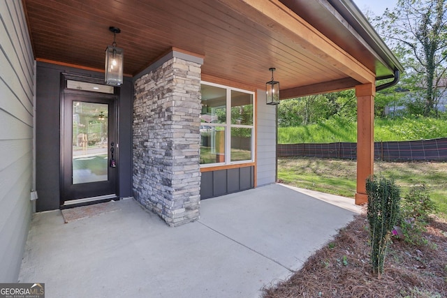 view of patio / terrace with a porch and fence