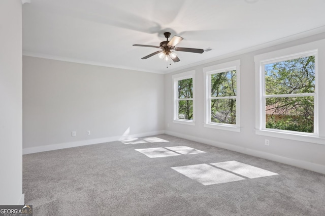 empty room featuring carpet flooring, ceiling fan, and baseboards