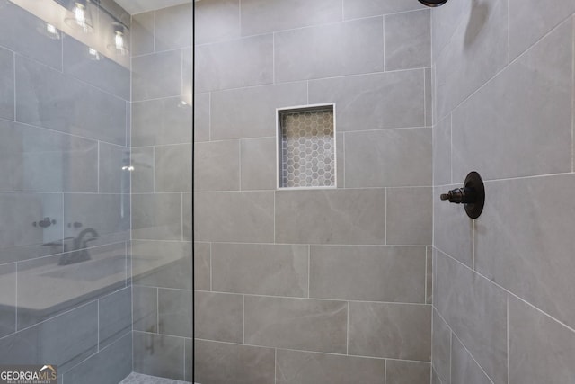 full bath featuring a tile shower
