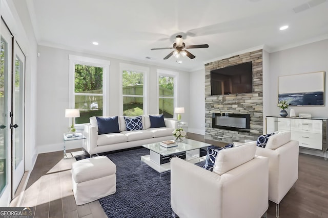 living room featuring crown molding, visible vents, and wood finished floors