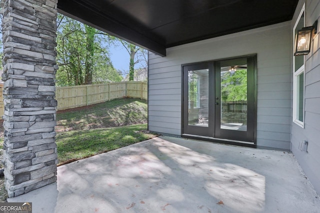 view of patio featuring fence