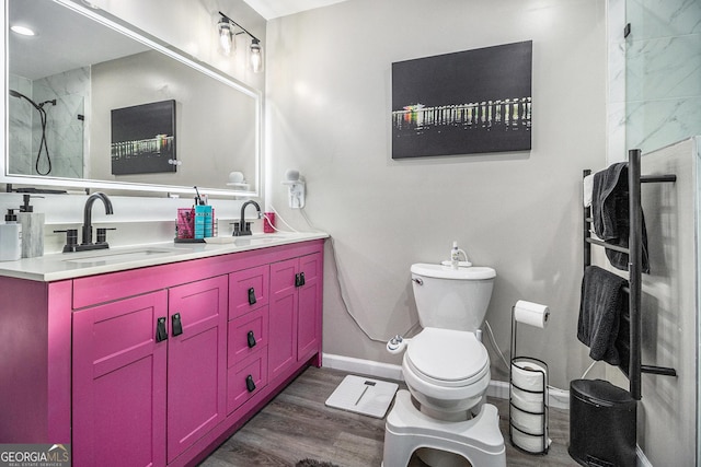 196 Wadley St NW, Atlanta, GA 30314 - full bathroom featuring double vanity, wood finished floors, and a shower