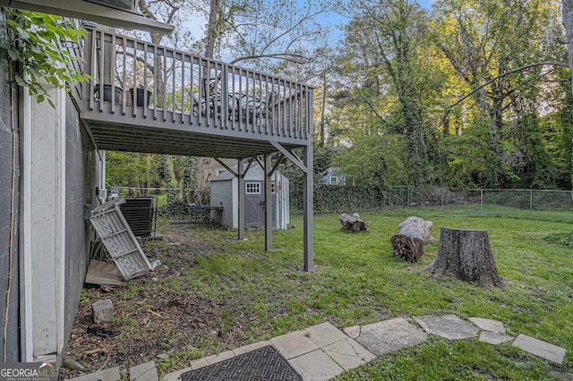 196 Wadley St NW, Atlanta, GA 30314 - fenced backyard featuring a storage unit and a wooden deck