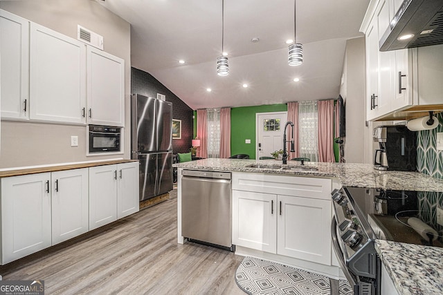 196 Wadley St NW, Atlanta, GA 30314 - kitchen featuring stainless steel appliances, extractor fan, a peninsula, light wood finished floors, and white cabinets