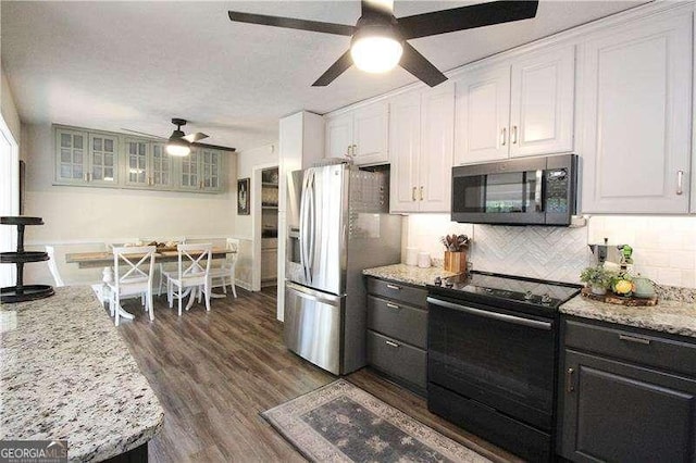 kitchen featuring a ceiling fan, decorative backsplash, electric range, stainless steel refrigerator with ice dispenser, and white cabinetry