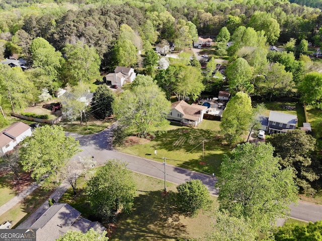 bird's eye view with a residential view and a view of trees