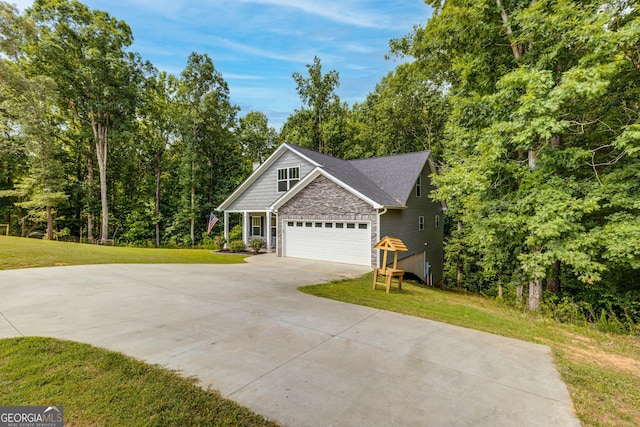 view of home's exterior with an attached garage, roof with shingles, driveway, and a lawn