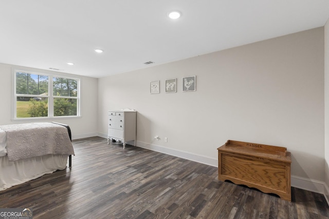 bedroom with baseboards, recessed lighting, and dark wood finished floors