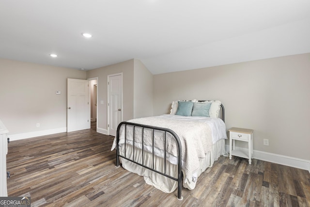 bedroom featuring baseboards, recessed lighting, and wood finished floors