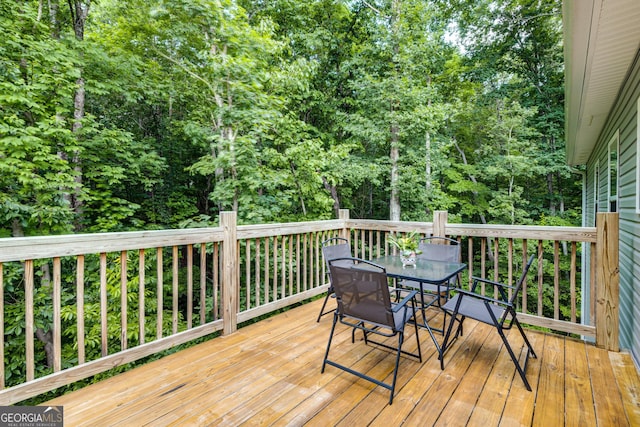 wooden deck with outdoor dining area