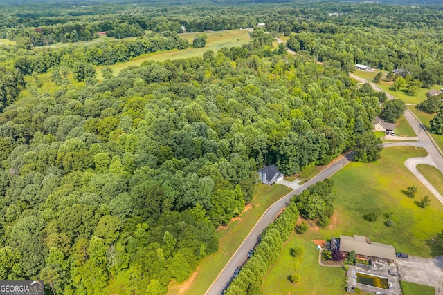 aerial view with a wooded view